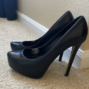 Black platform pumps
